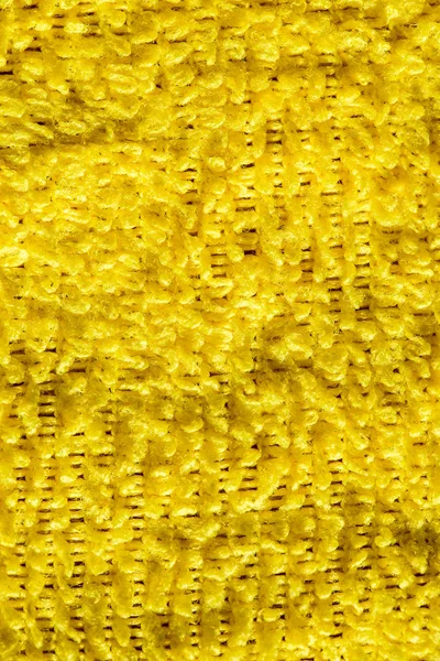 Fabric pile yellow background — Stock Photo, Image