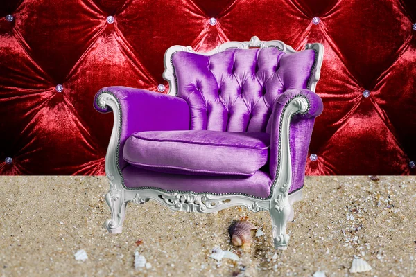 Violet  armchair is  on the sand — Stock Photo, Image