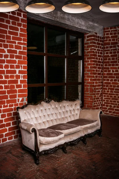 Living room with beige sofa on the  red brick wall — Stock Photo, Image