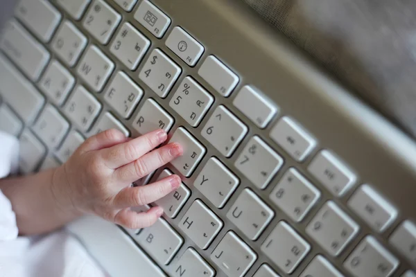 Close-up of a Baby's Hand Using Keyboard