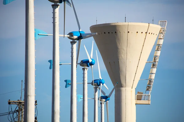 Green renewable energy concept - wind generator turbines and tow — Stock Photo, Image