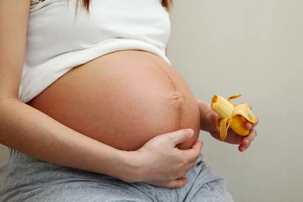 Pregnant Woman Holding Banana — Stock Photo, Image