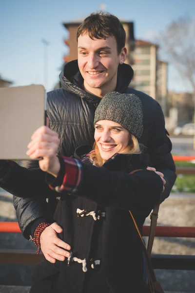 Couple having fun while using tablet — Stock Photo, Image