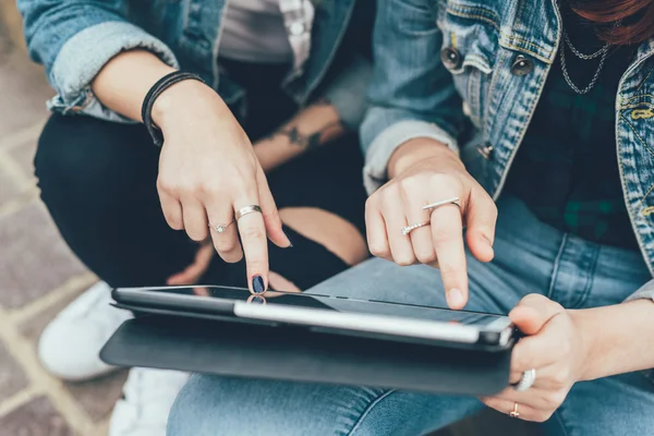 Women tapping the screen of tablet — Stock Photo, Image