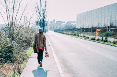 woman walking down the road 