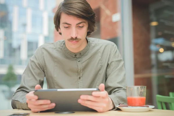 Man with mustache using technological devices — Stock Photo, Image