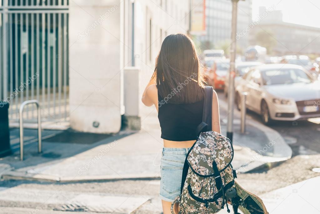 asiatic woman walking in city