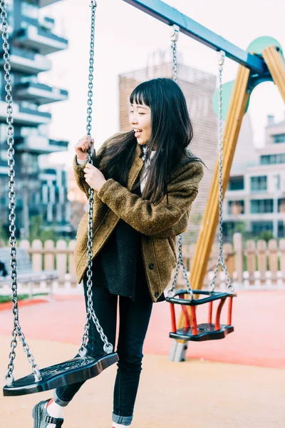 Woman playing on a seesaw — Stok fotoğraf