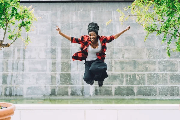 Woman jumping in air outdoor — Stock Photo, Image