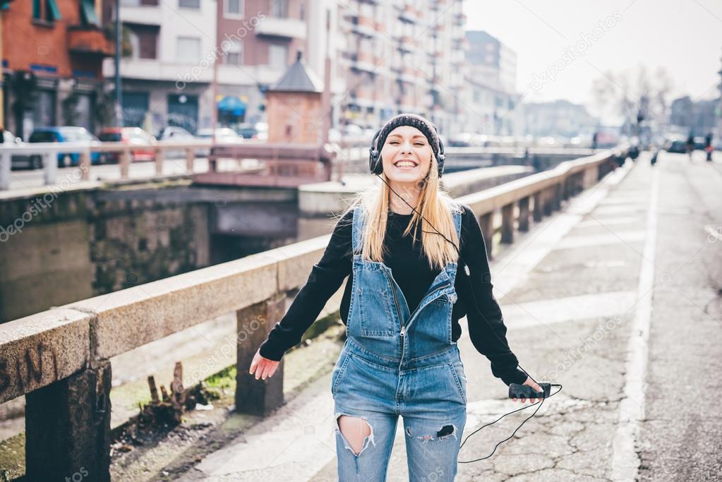 woman in city listening music