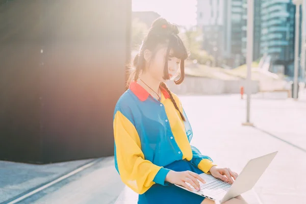 asian millennial woman using computer