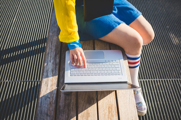 Woman tapping keyboard of notebook — Stock Photo, Image