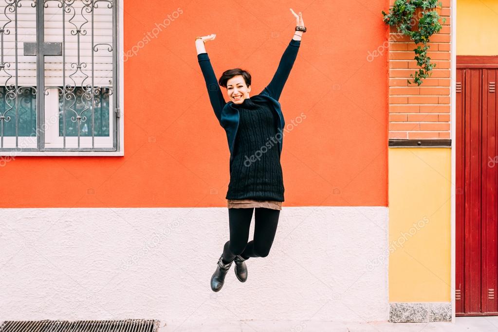 woman jumping in the street 