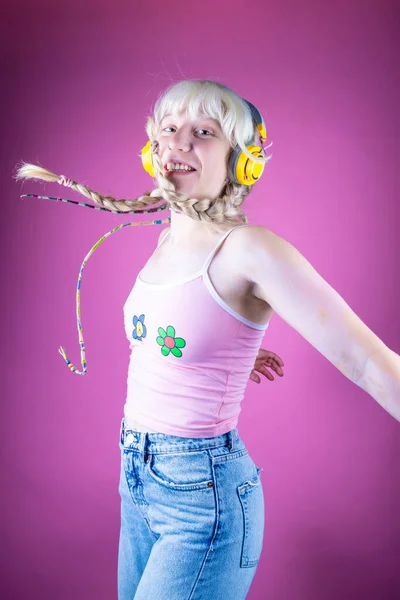 Young Caucasian Woman Vitiligo Jumping Pink Background Listening Enjoying Music — Stock Photo, Image