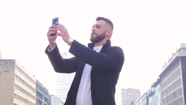 Young Bearded Caucasian Businesslike Man Outdoor Using Smartphone Taking Selfie — Stok video