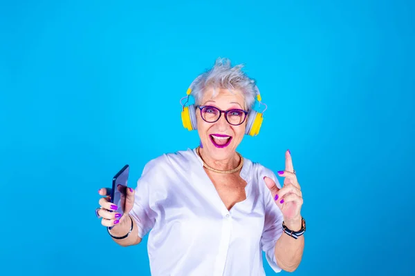 Senior Grandmother Woman Holding Smartphone Dancing Listening Music Isolated — Stock Photo, Image