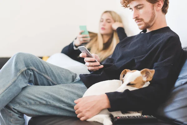 Young Man Sitting Couch Indoor Home Using Smartphone Jack Russel — Stock Photo, Image