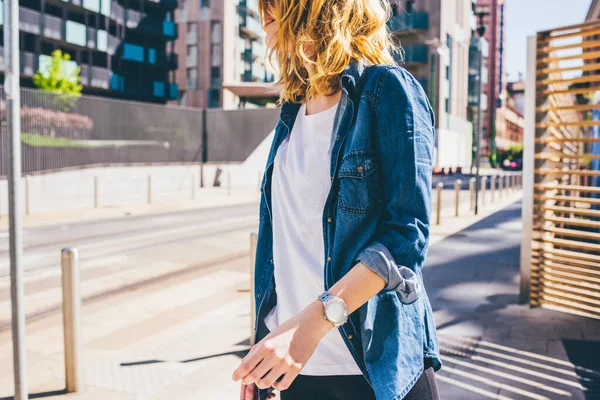 Middle section young beautiful caucasian blonde hair woman walking outdoor in the city