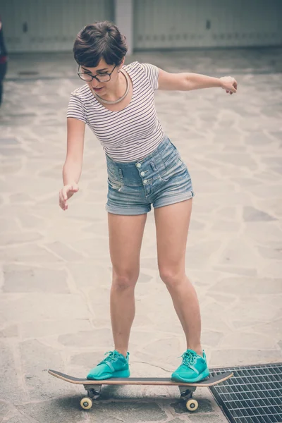 Young hipster woman with skate — Stock Photo, Image