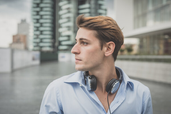 young model hansome blonde man with headphones