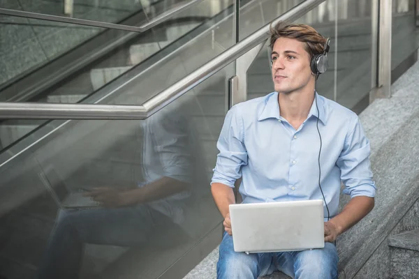 Young model hansome blonde man headphone and notebook — Stock Photo, Image