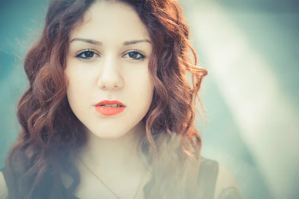 Young beautiful hipster woman with red curly hair — Stock Photo, Image