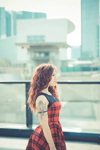 Young beautiful hipster woman with red curly hair — Stock Photo, Image