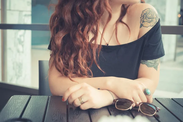 Young beautiful hipster woman with red curly hair — Stock Photo, Image