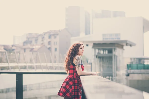 Young beautiful hipster woman with red curly hair — Stock Photo, Image