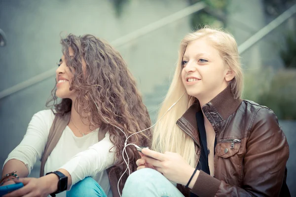 Young women using smart phone Stock Image