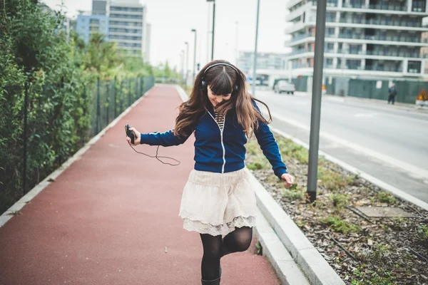 Beautiful woman dancing in a desolate landscape — Stock Photo, Image