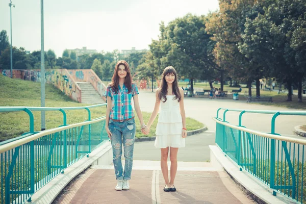 Beautiful hipster young women sisters friends — Stock Photo, Image