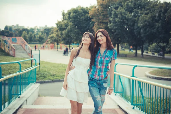 Beautiful hipster young women sisters friends — Stock Photo, Image