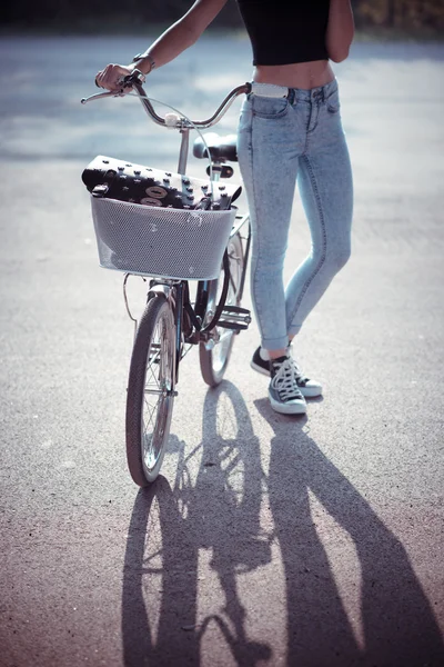 Close up of legs woman on bike — Stock Photo, Image