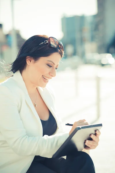 Beautiful long black hair elegant business woman using tablet — Stock Photo, Image