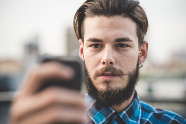 young handsome bearded hipster man selfie