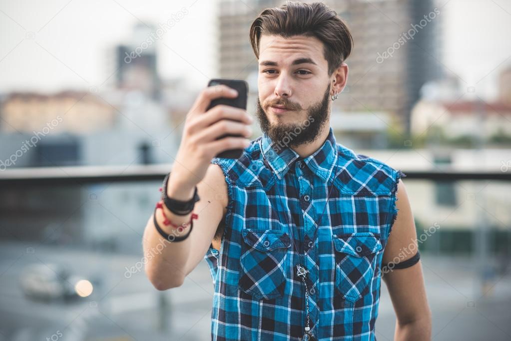 young handsome bearded hipster man selfie