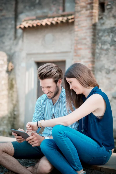 Young beautiful couple lovers using tablet — Stock Photo, Image