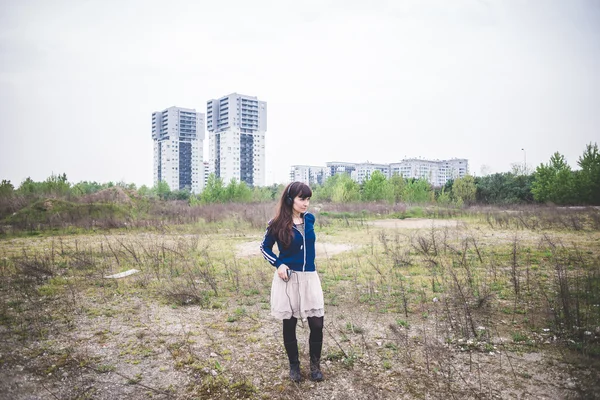 Beautiful woman in a desolate landscape — Stock Photo, Image