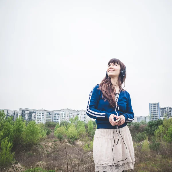 Beautiful woman in a desolate landscape — Stock Photo, Image