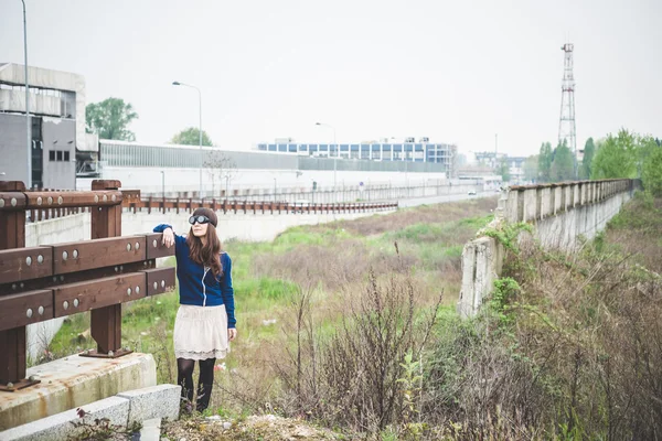 Beautiful woman in a desolate landscape — Stock Photo, Image