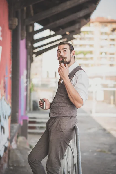 Handsome big moustache hipster man smoking pipe — Stock Photo, Image