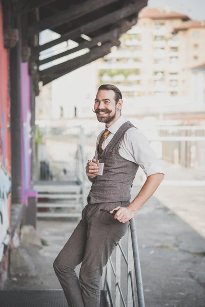 Handsome big moustache hipster man smoking pipe — Stock Photo, Image