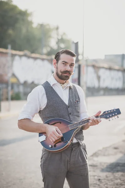 Handsome big moustache hipster man playing mandolin — Stock Photo, Image