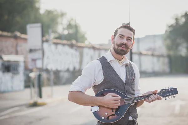 Handsome big moustache hipster man playing mandolin — Stock Photo, Image