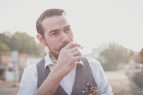 Handsome big moustache hipster man smoking cigarette — Stock Photo, Image