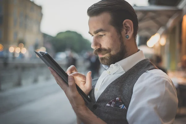 Handsome big moustache hipster man using tablet — Stock Photo, Image