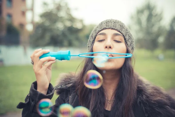 Woman blowing bubbles soap — Stock Photo, Image