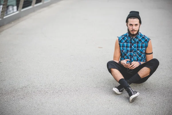 Handsome hipster man listening music — Stock Photo, Image