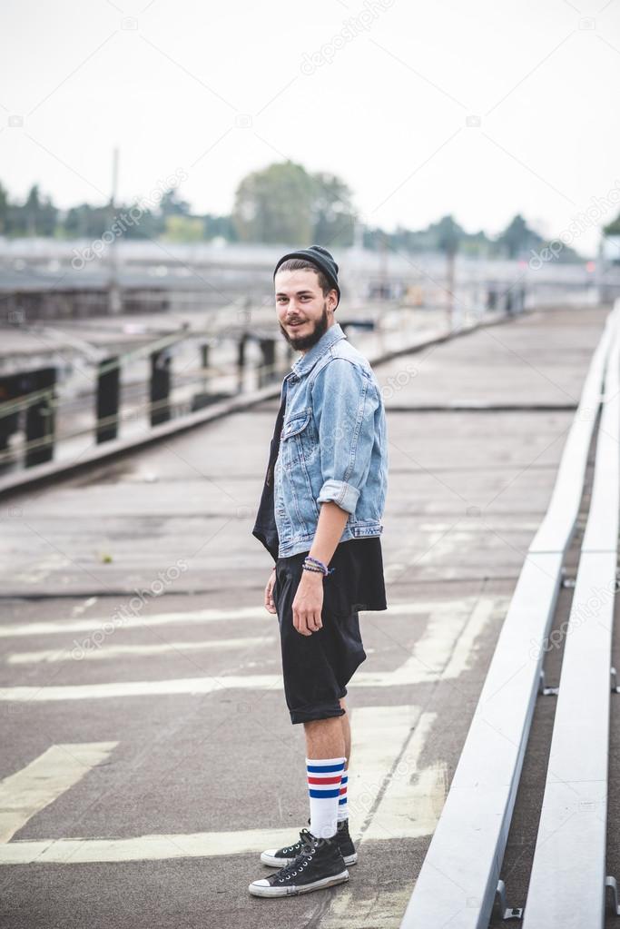 Bearded hipster man  standing on the street